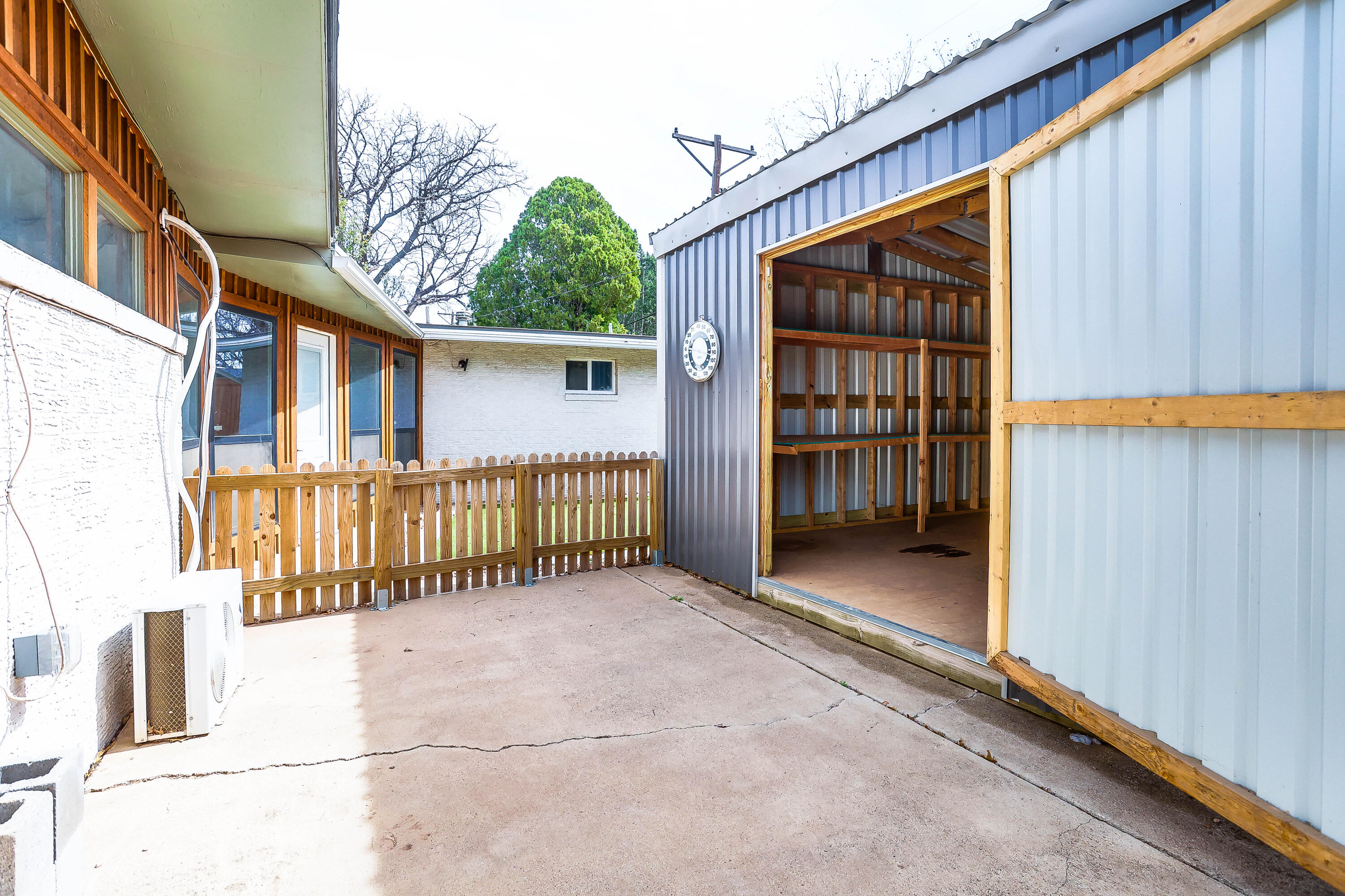 3615 47th Street Lubbock, TX 79413 - Photo 33 of 36 a view of a house with a wooden fence