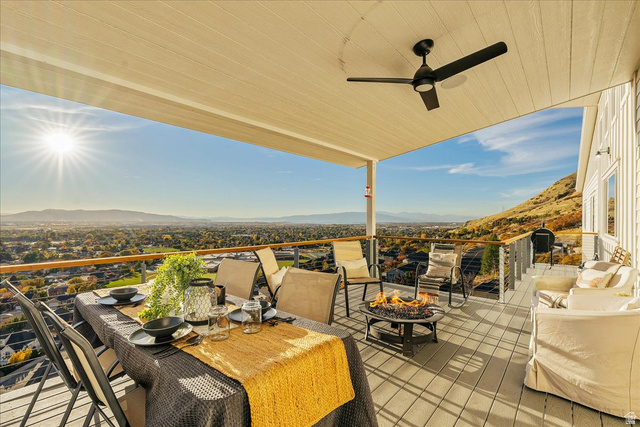 1800 Spring Oaks Drive Springville, UT 84663 - Photo 25 of 68 View of patio / terrace with a mountain view, a ceiling fan, and outdoor dining space