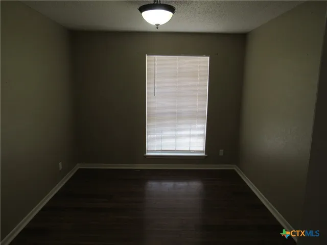 a kitchen with a sink a refrigerator and a stove