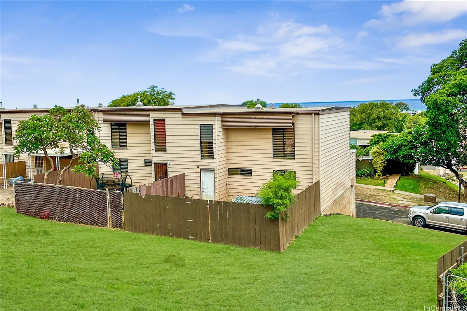 87217 Helelua Street, Unit 1 Waianae, HI 96792 - Photo 4 of 15 a front view of a house with a yard
