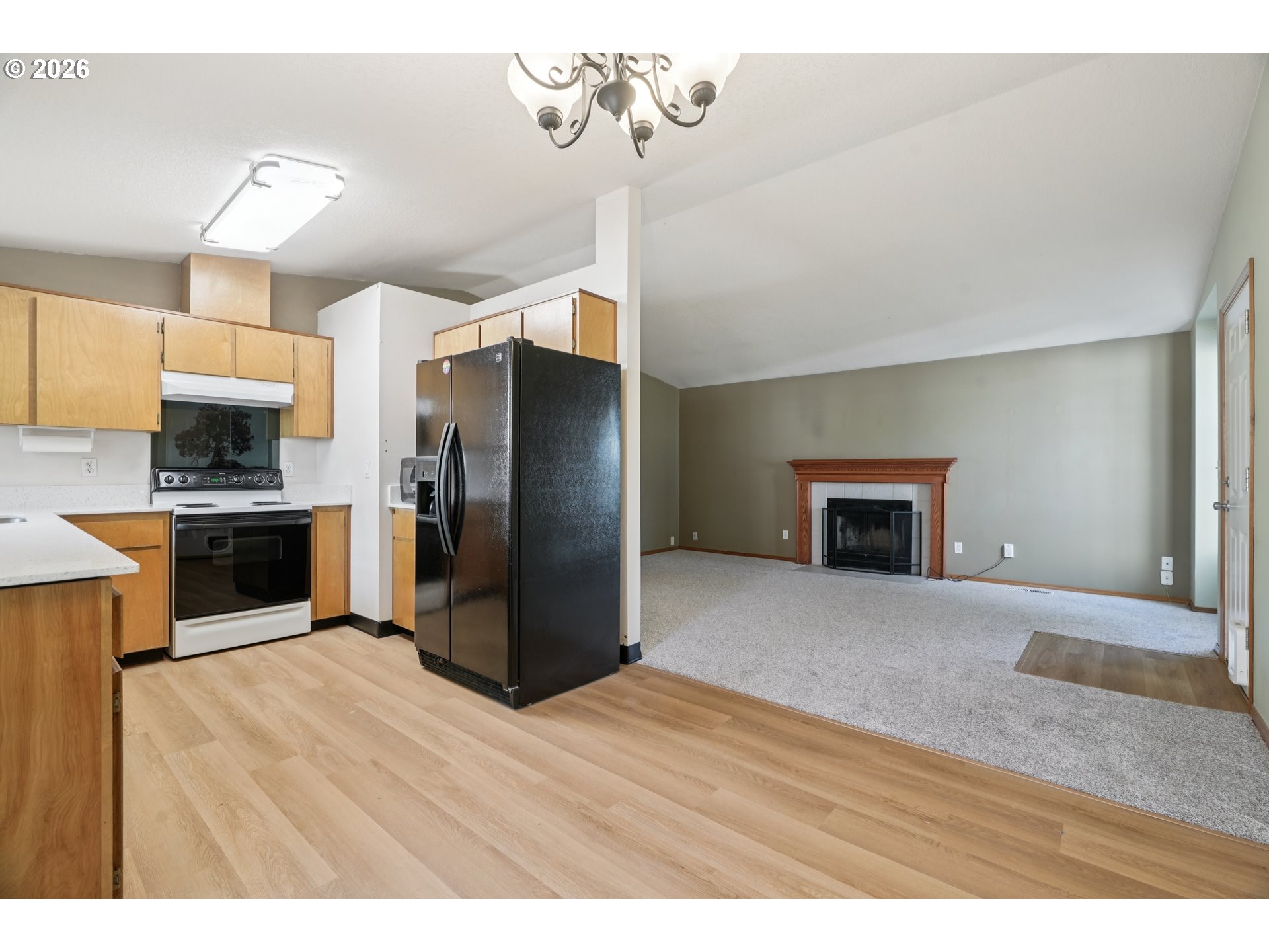 7306 Southeast 76th Avenue Portland, OR 97206 - Photo 11 of 34 a kitchen with kitchen island a counter top space appliances and cabinets