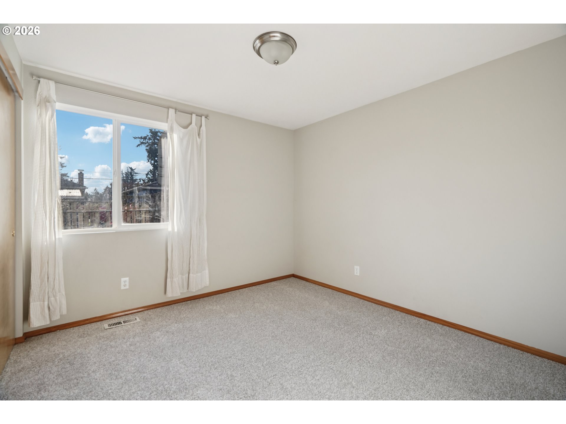 7306 Southeast 76th Avenue Portland, OR 97206 - Photo 15 of 34 a view of an empty room with a window