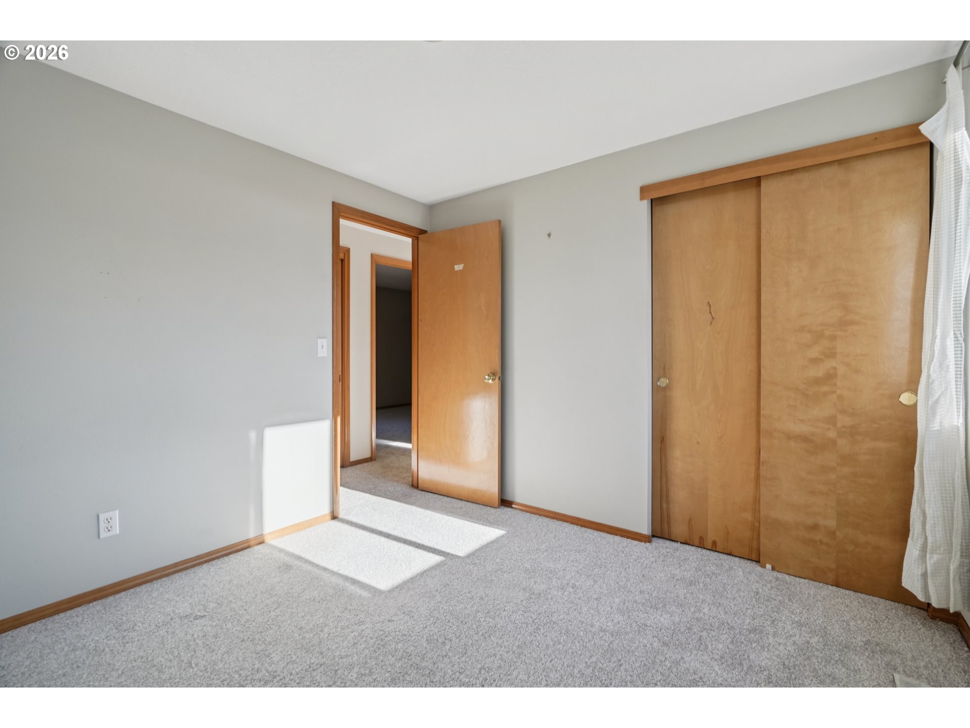 7306 Southeast 76th Avenue Portland, OR 97206 - Photo 16 of 34 a view of an empty room with wooden floor