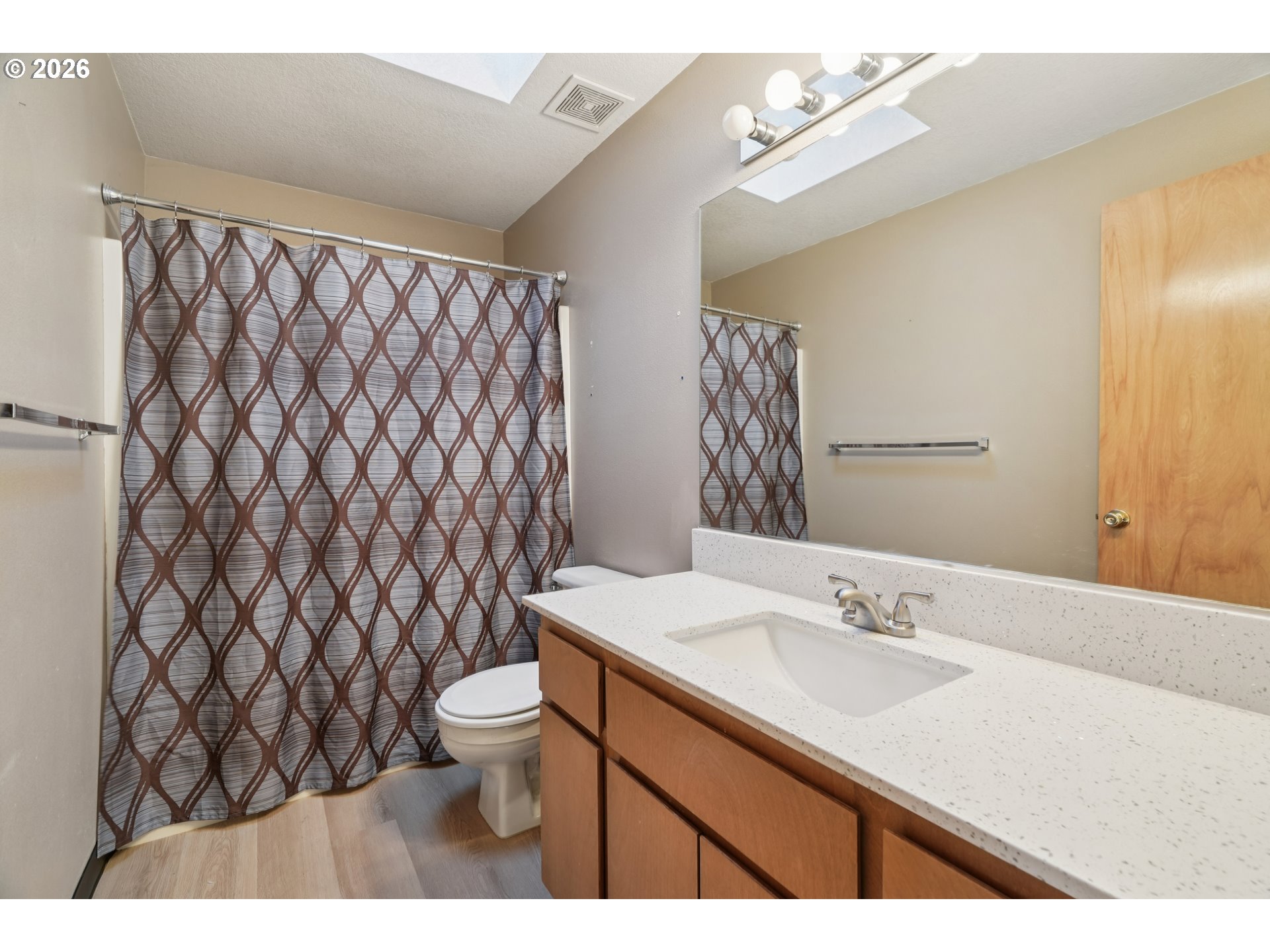 7306 Southeast 76th Avenue Portland, OR 97206 - Photo 17 of 34 a bathroom with a sink and a mirror