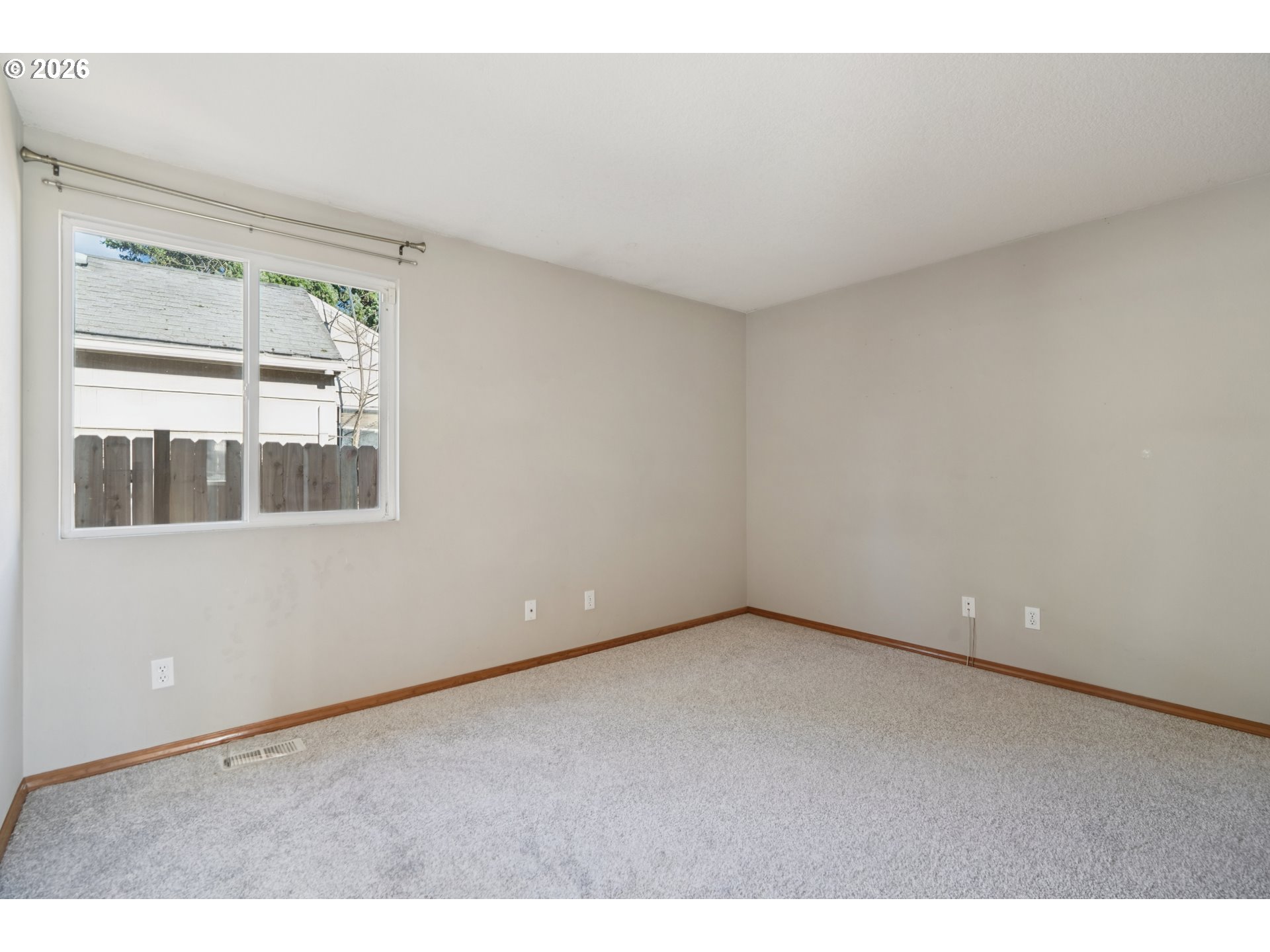 7306 Southeast 76th Avenue Portland, OR 97206 - Photo 18 of 34 a view of an empty room with a window