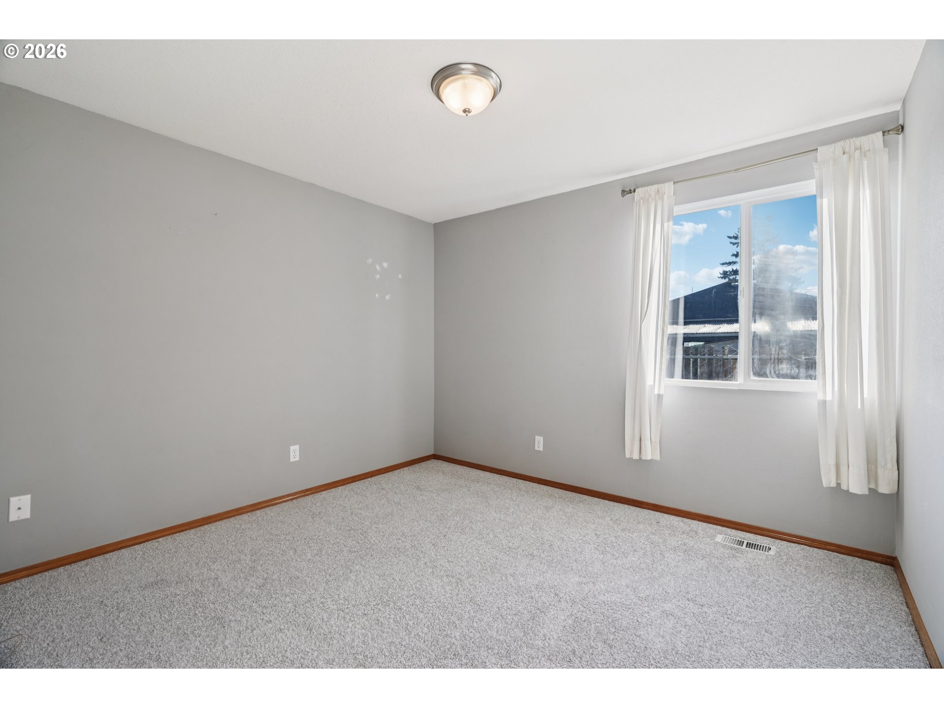 7306 Southeast 76th Avenue Portland, OR 97206 - Photo 23 of 34 a view of an empty room with a window