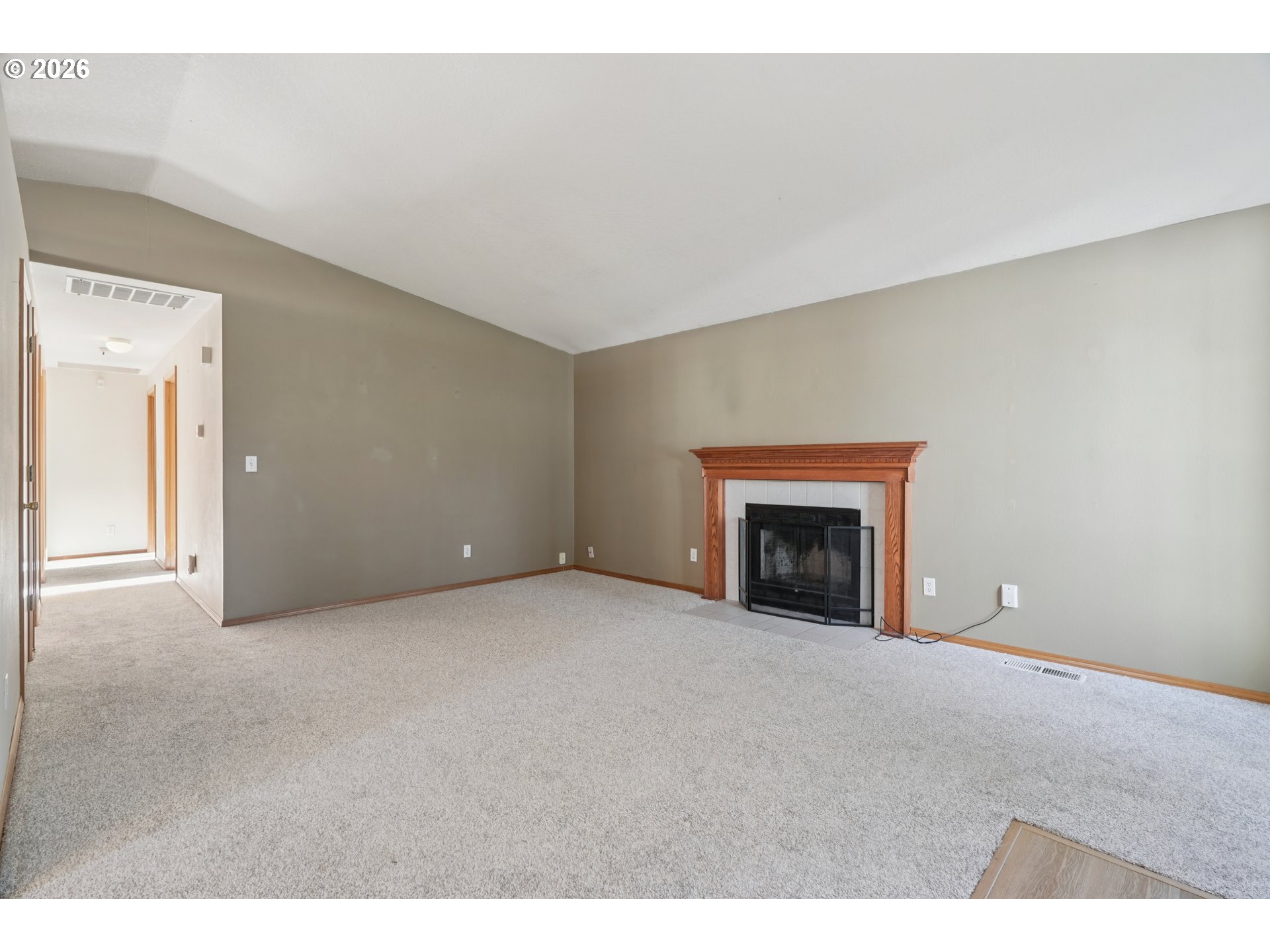 7306 Southeast 76th Avenue Portland, OR 97206 - Photo 4 of 34 a view of an empty room with a fireplace