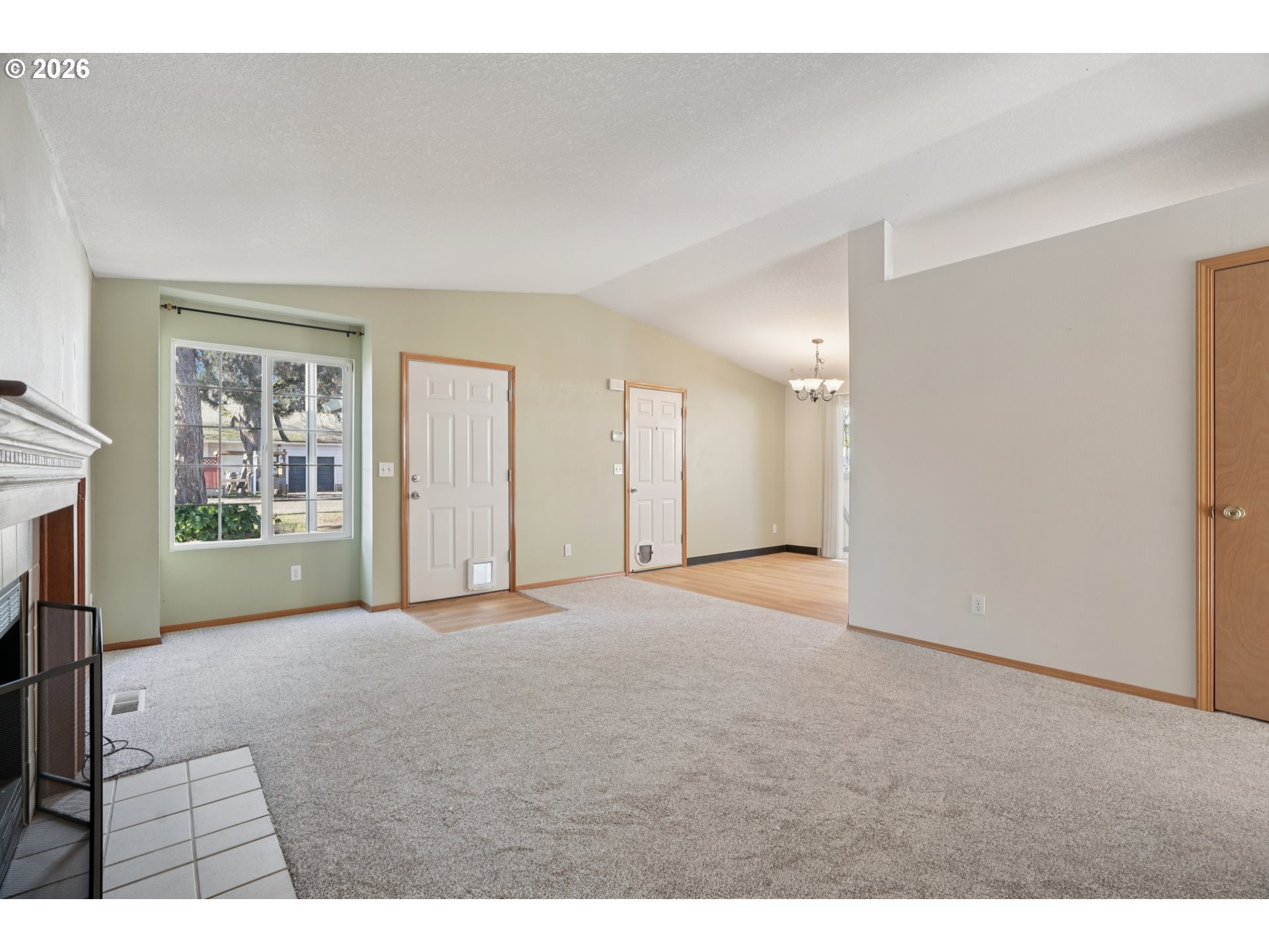 7306 Southeast 76th Avenue Portland, OR 97206 - Photo 6 of 34 a view of an empty room with a window
