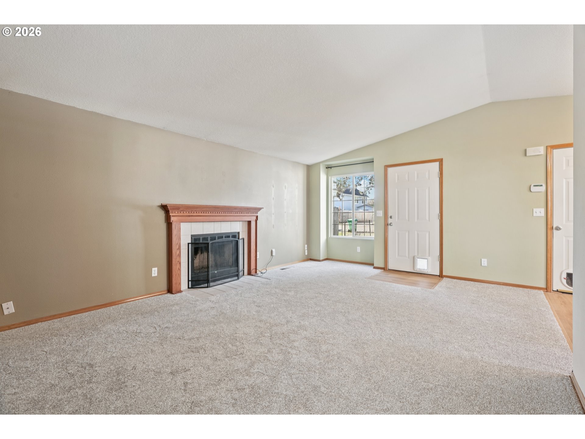 7306 Southeast 76th Avenue Portland, OR 97206 - Photo 7 of 34 a view of an empty room with a fireplace
