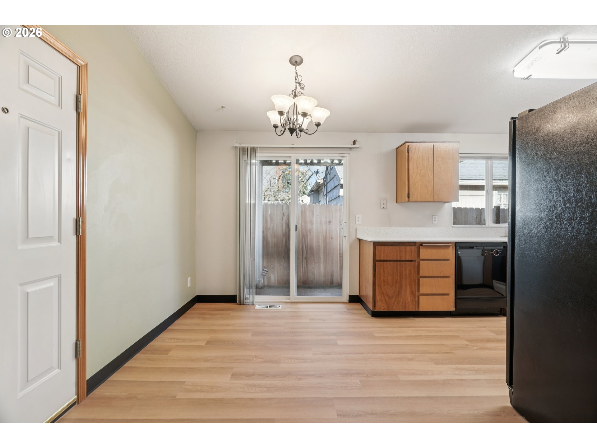 7306 Southeast 76th Avenue Portland, OR 97206 - Photo 8 of 34 a view of a kitchen with a sink and a refrigerator