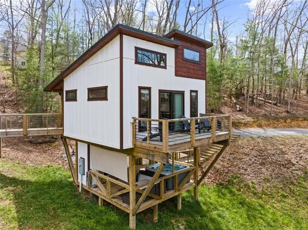 a view of a lush green hillside and houses