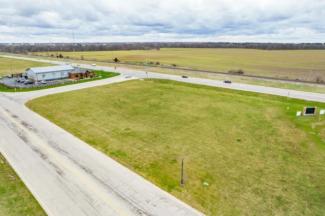 a view of an outdoor swimming pool and an ocean view