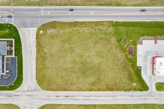 a view of swimming pool with lawn chairs