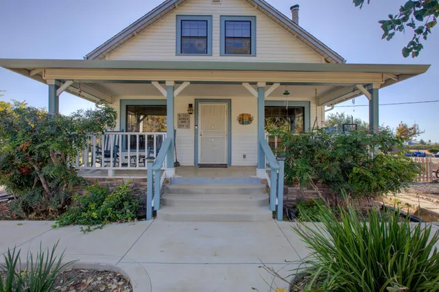 an aerial view of a house with a lake view