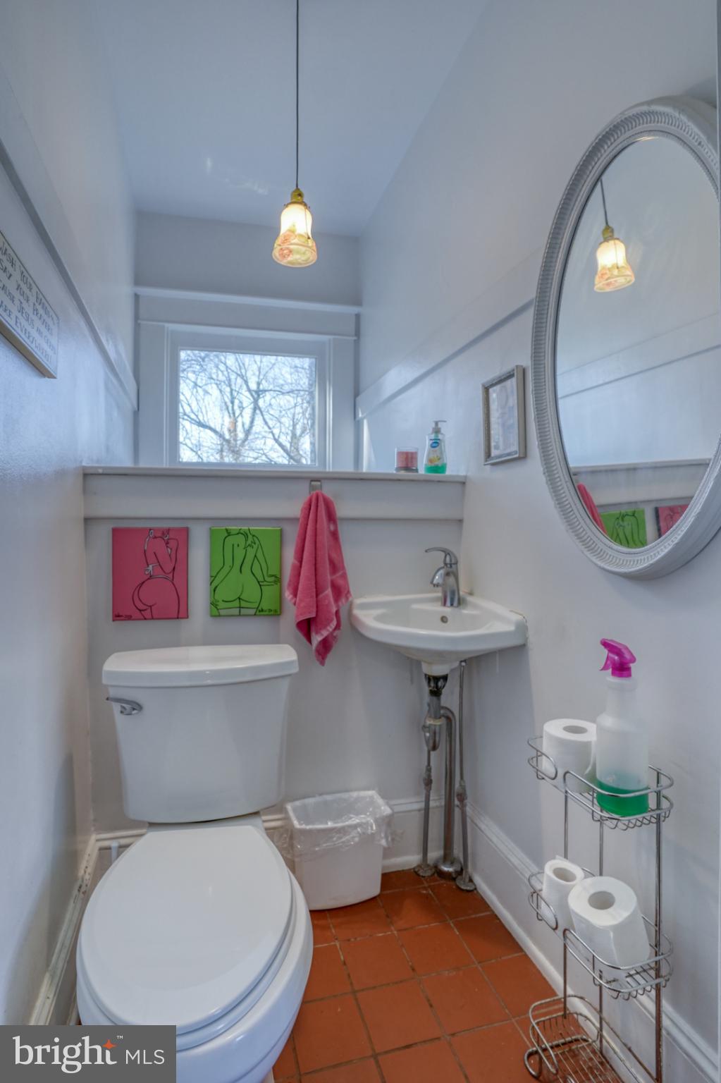 4096 Main Street Trappe, MD 21673 - Photo 39 of 70 a bathroom with a toilet a sink and a mirror