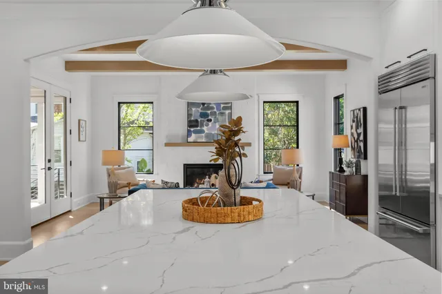 a living room with fireplace furniture and a window