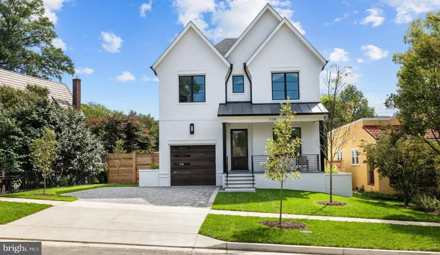 a view of a house with a yard and a garden