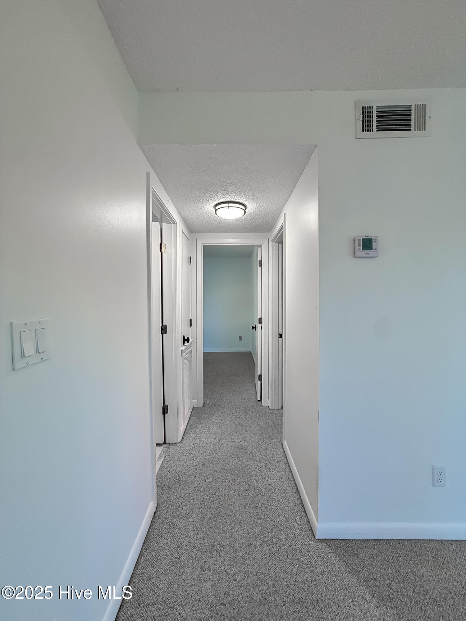10 Pine Tree Road, Unit 203 Pinehurst, NC 28374 - Photo 17 of 42 Hallway to Guest Bathroom & Bedrooms