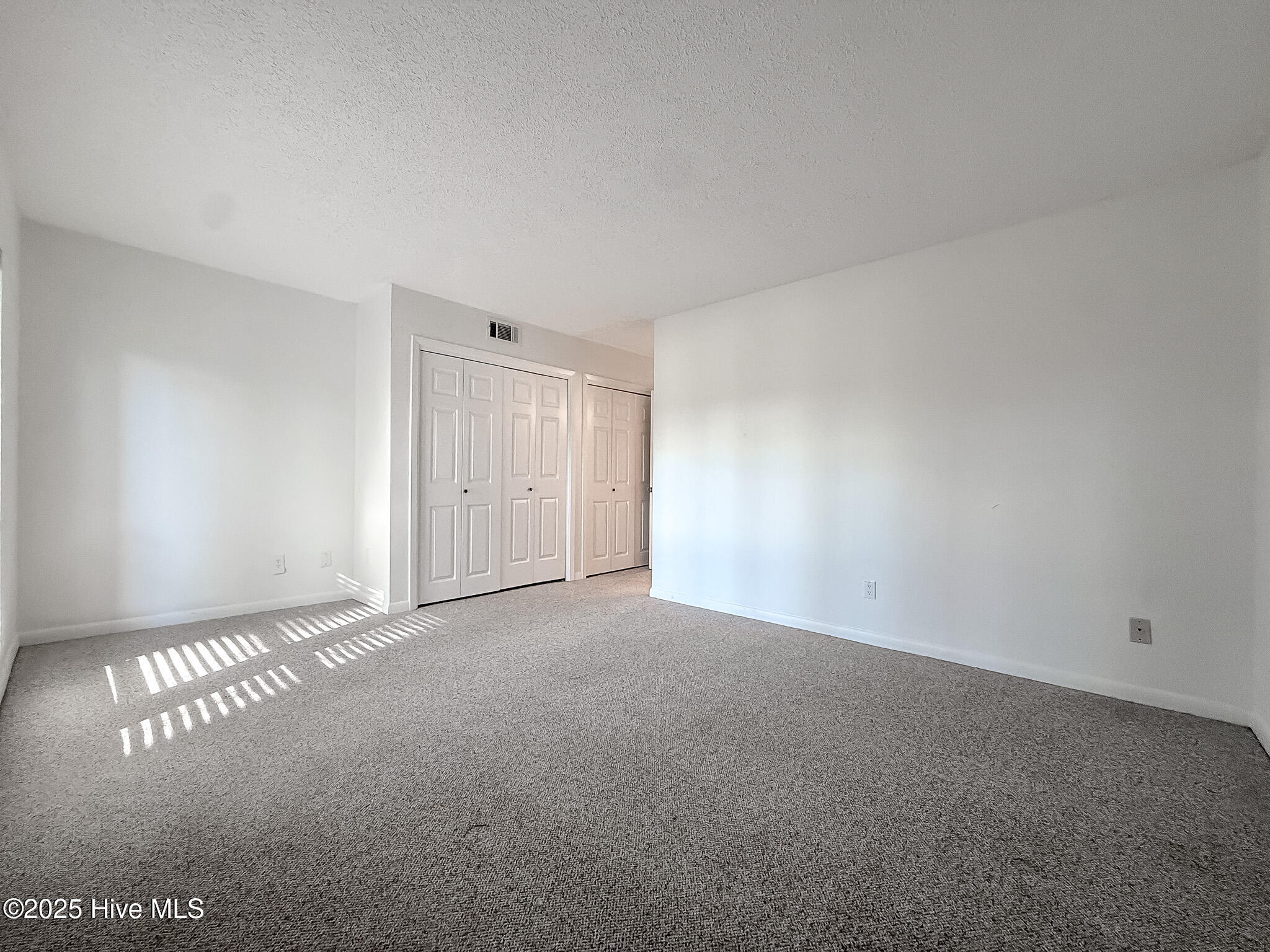 10 Pine Tree Road, Unit 203 Pinehurst, NC 28374 - Photo 25 of 42 Primary Bedroom w/Two Separate Closets