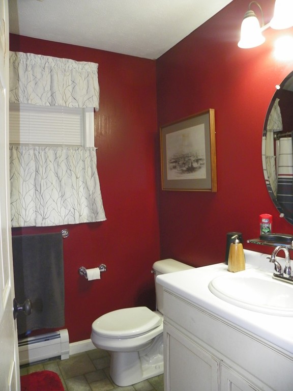 755 Old New Ipswich Road Rindge, NH 03461 - Photo 16 of 20 a bathroom with a toilet a sink and mirror