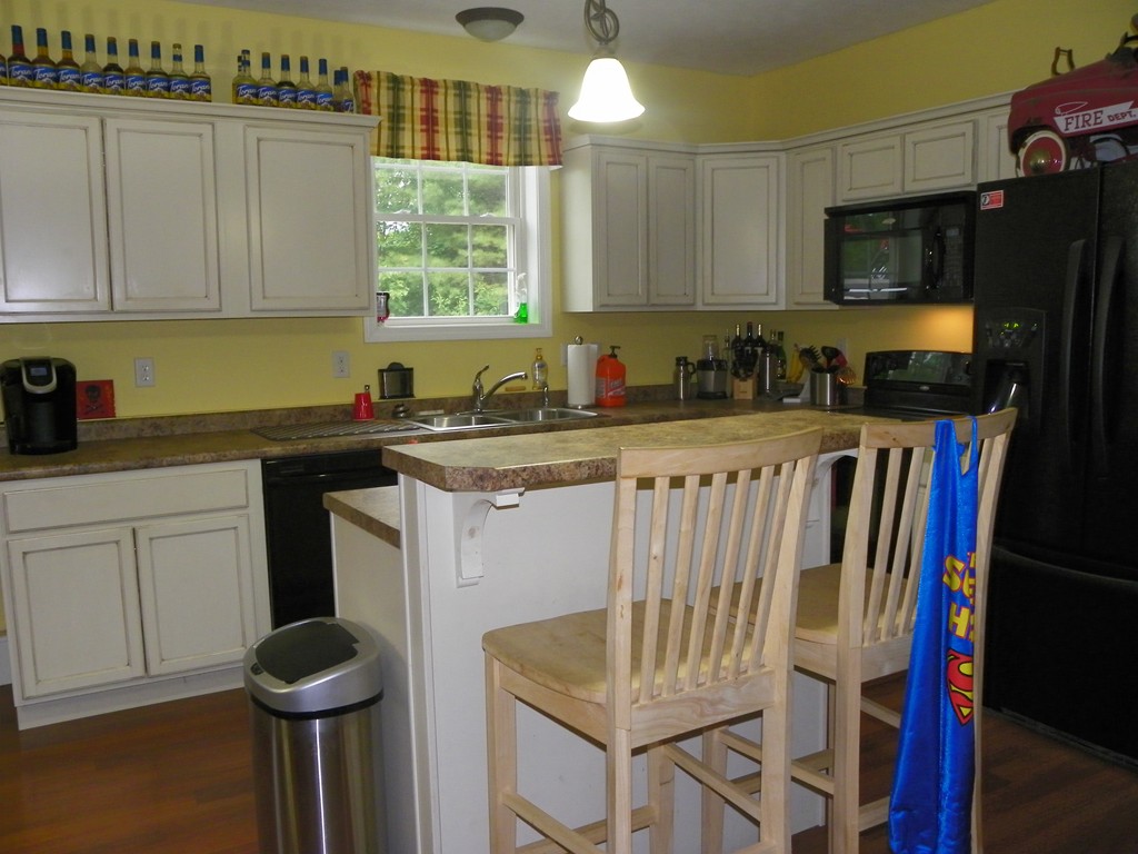 755 Old New Ipswich Road Rindge, NH 03461 - Photo 7 of 20 a kitchen with stainless steel appliances granite countertop a sink a stove and a refrigerator