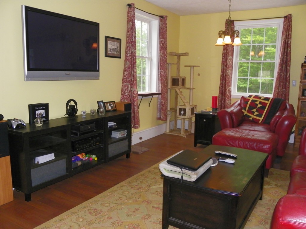 755 Old New Ipswich Road Rindge, NH 03461 - Photo 8 of 20 a living room with furniture and a flat screen tv