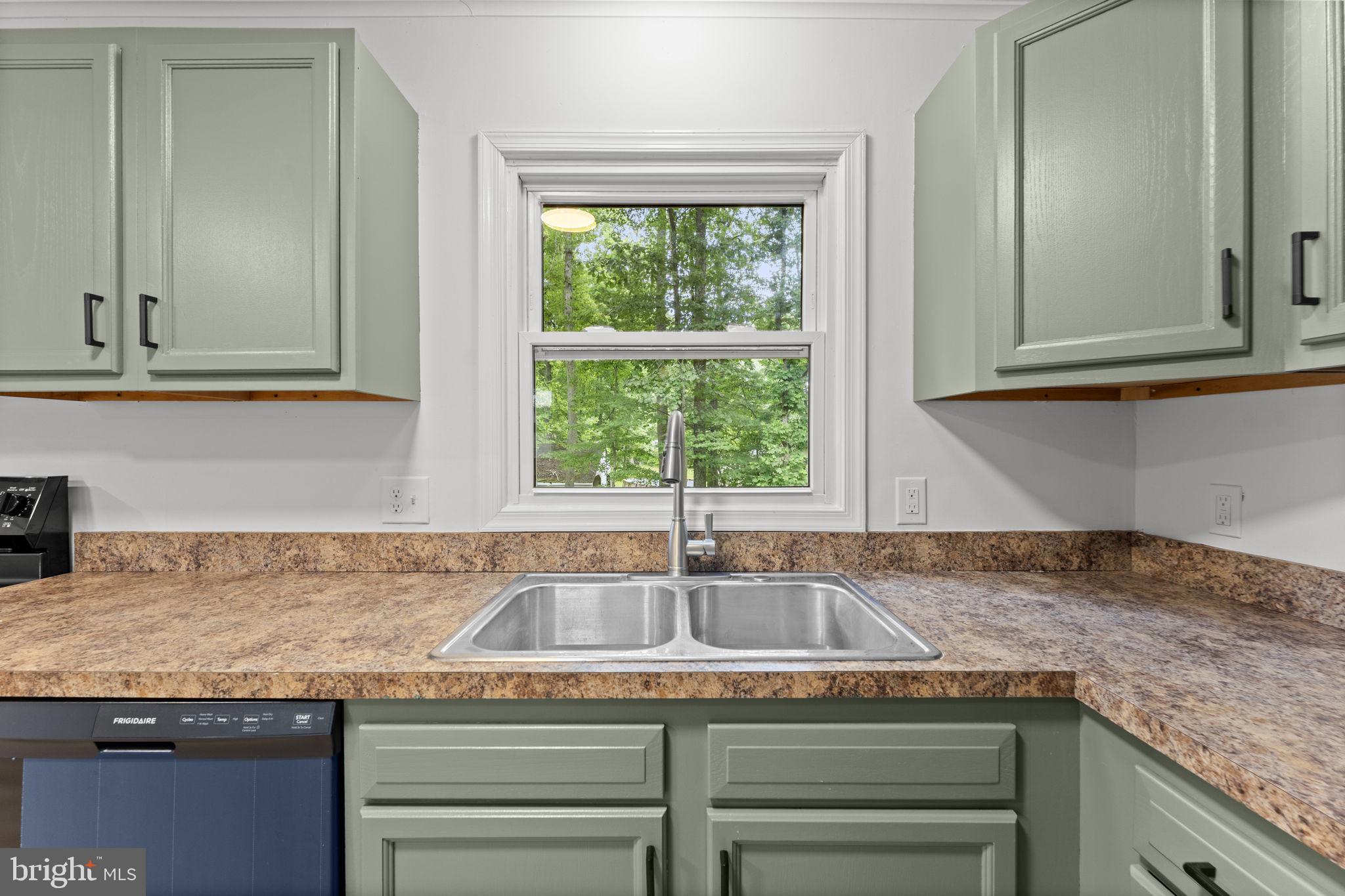 1821 James City Road Reva, VA 22735 - Photo 18 of 44 a kitchen with granite countertop a sink and a window