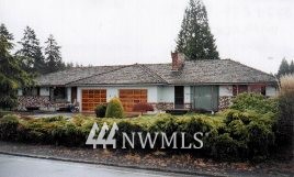 879 King Road Winlock, WA 98596 - Photo 1 of 1 a front view of a house with garden