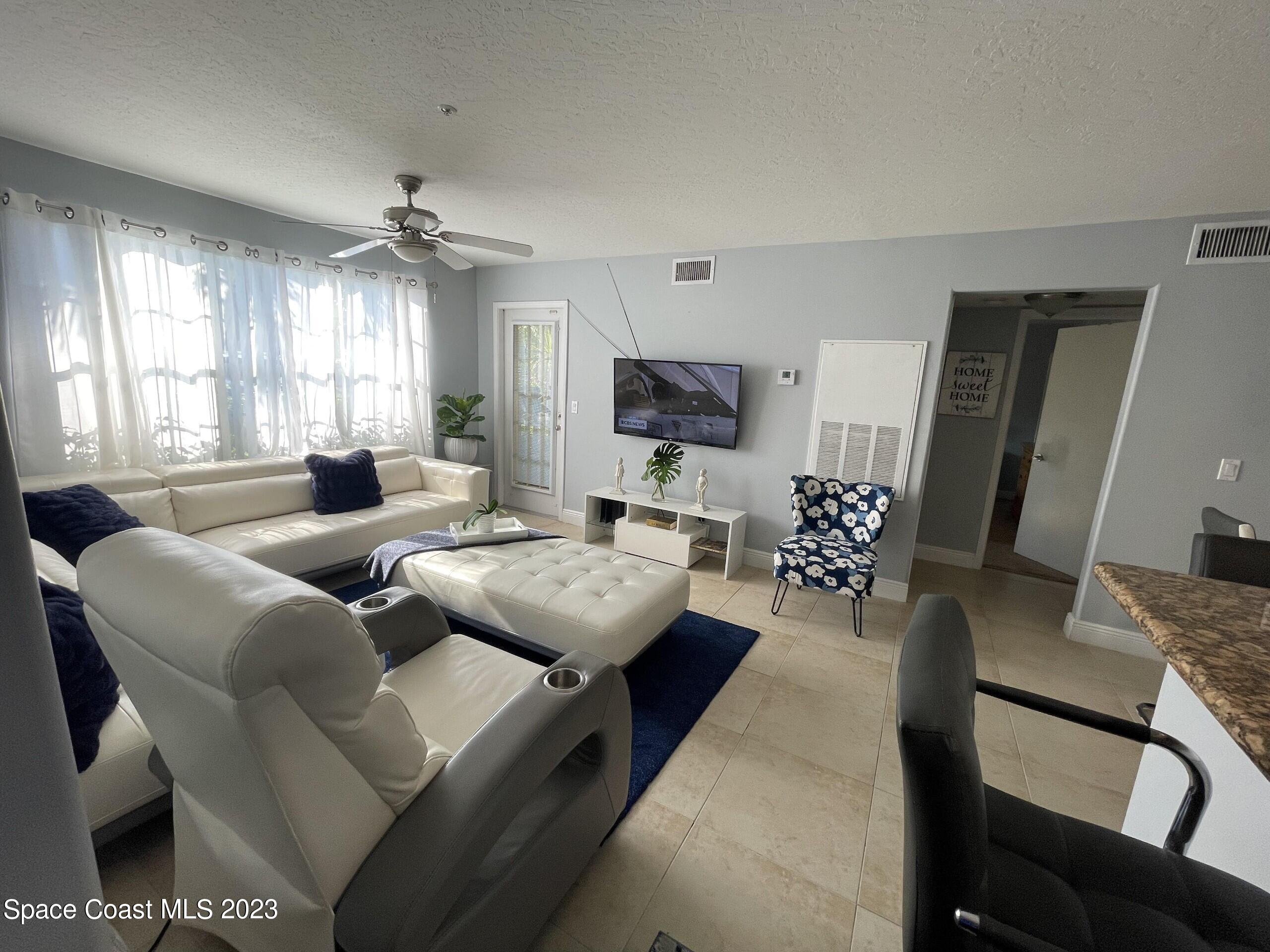 7667 North Wickham Road, Unit 805 Melbourne, FL 32940 - Photo 21 of 30 lIVINGROOM