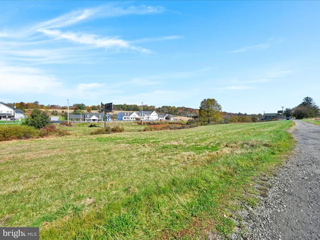 a view of a large building with a yard