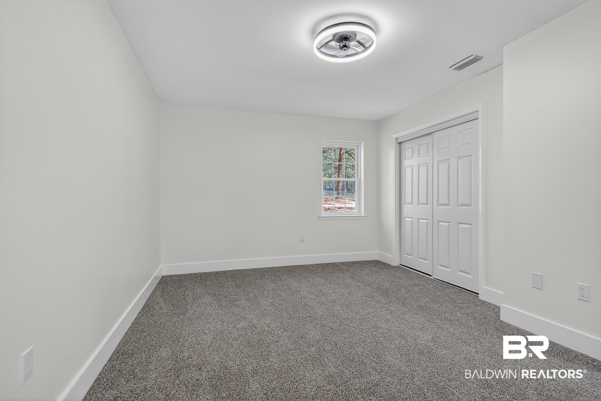 10650 Old Pascagoula Road Theodore, AL 36582 - Photo 45 of 77 Unfurnished bedroom featuring carpet and a closet