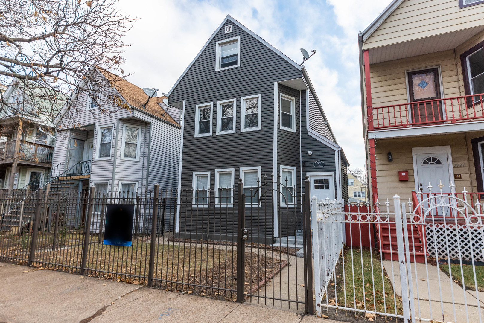 2923 North Avers Avenue, Unit 1 Chicago, IL 60618 - Photo 1 of 17 a view of a brick house with large windows