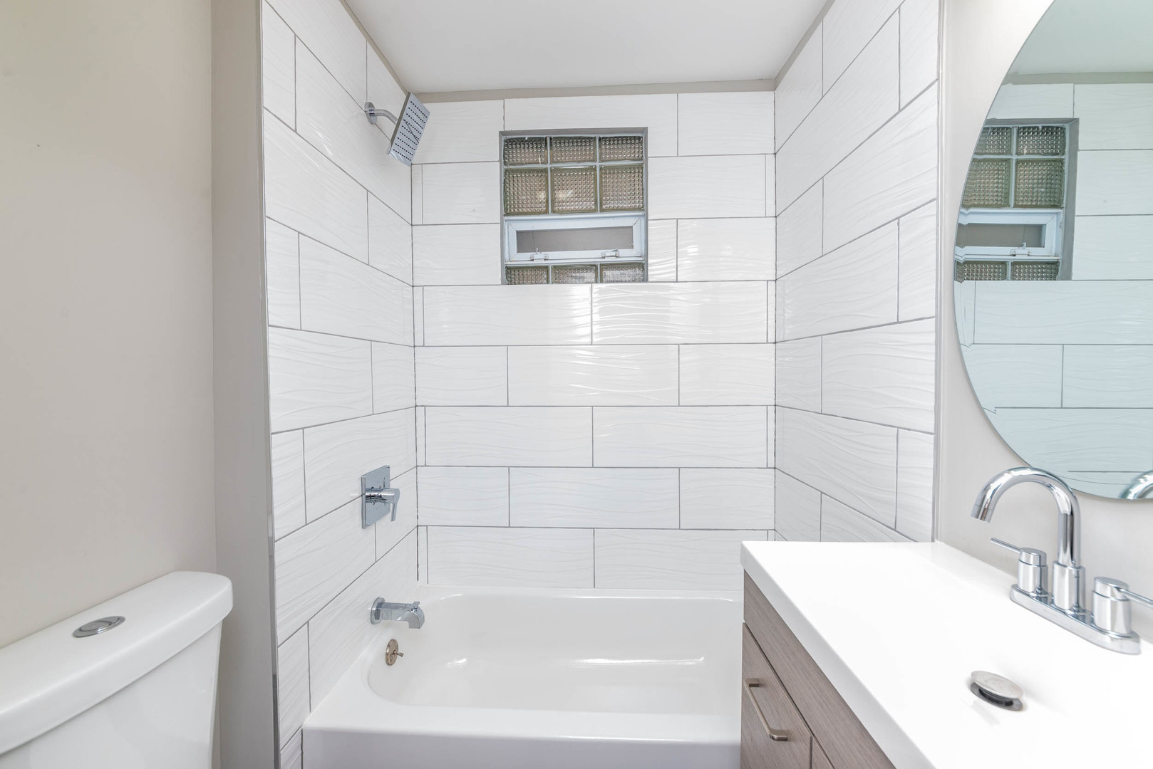 2923 North Avers Avenue, Unit 1 Chicago, IL 60618 - Photo 11 of 17 a bathroom with a sink and a bathtub