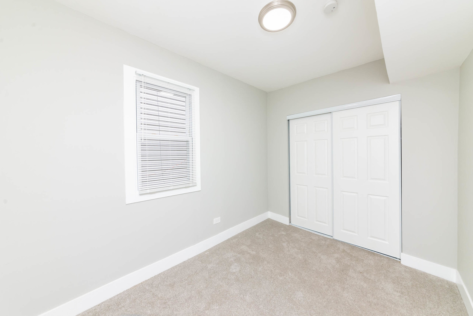 2923 North Avers Avenue, Unit 1 Chicago, IL 60618 - Photo 12 of 17 a view of an empty room with a window