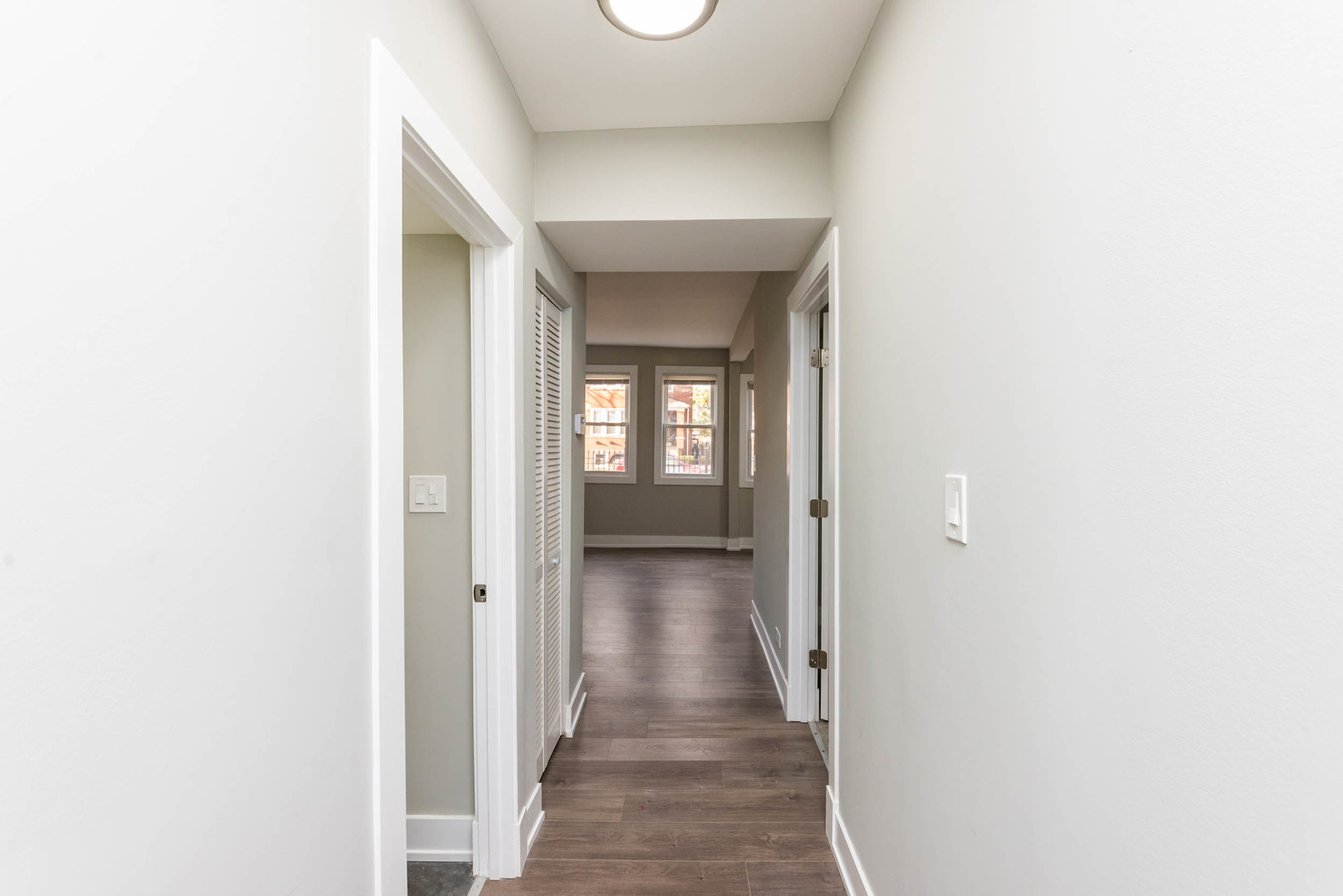 2923 North Avers Avenue, Unit 1 Chicago, IL 60618 - Photo 9 of 17 a view of a hallway with wooden floor