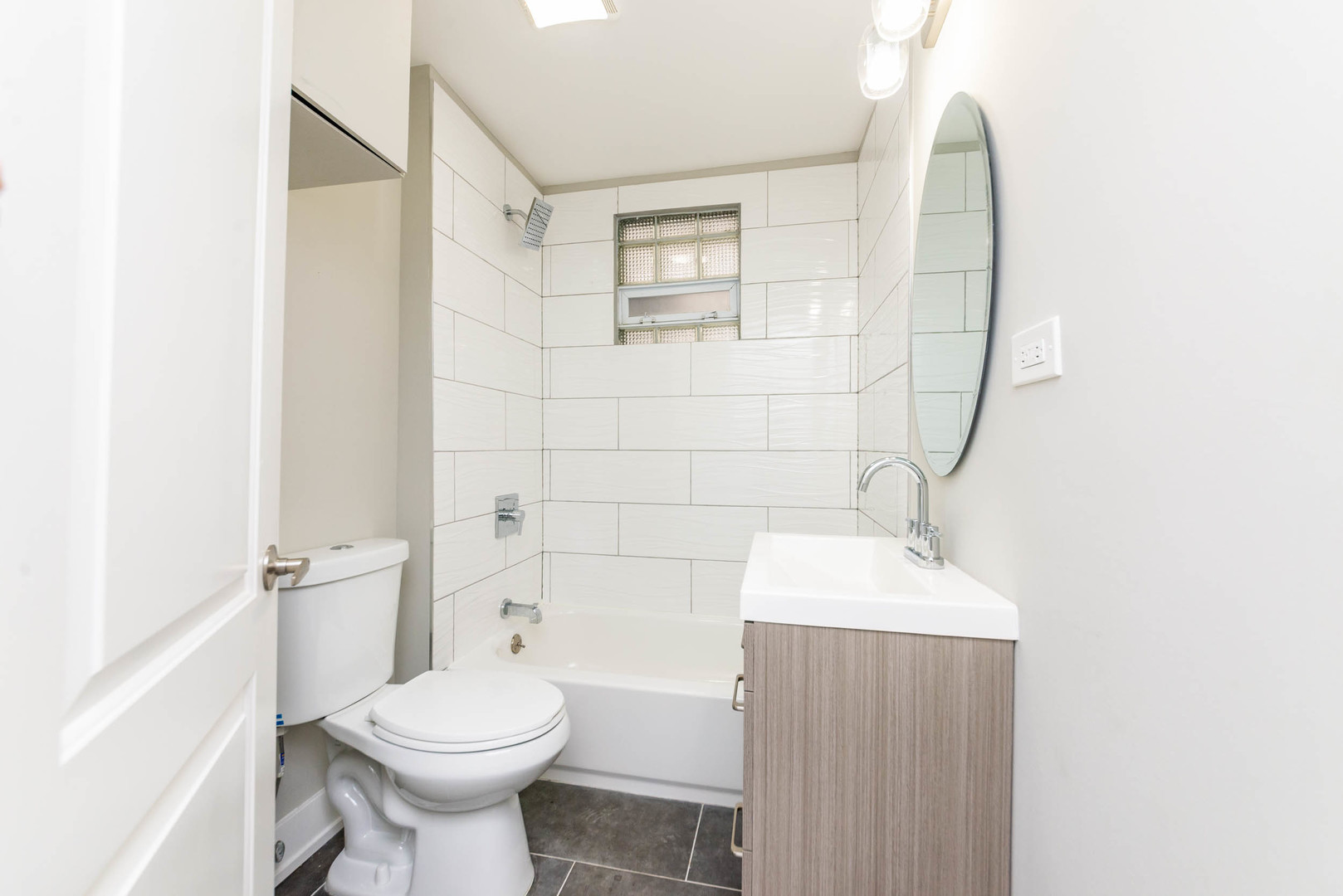 2923 North Avers Avenue, Unit 1 Chicago, IL 60618 - Photo 10 of 17 a bathroom with a sink toilet and shower