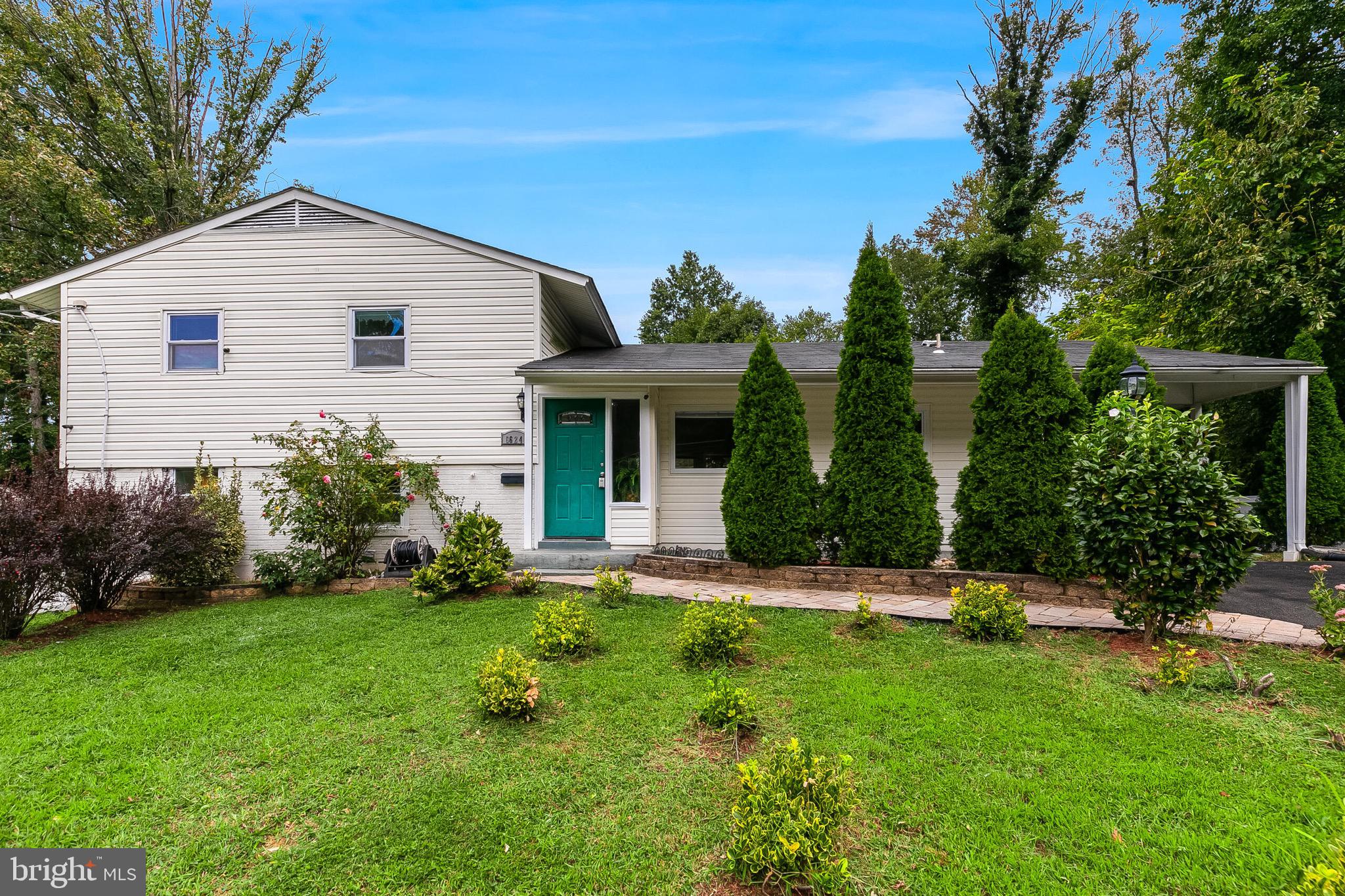 6624 Telegraph Road Alexandria, VA 22310 - Photo 20 of 36 a front view of a house with a yard and trees