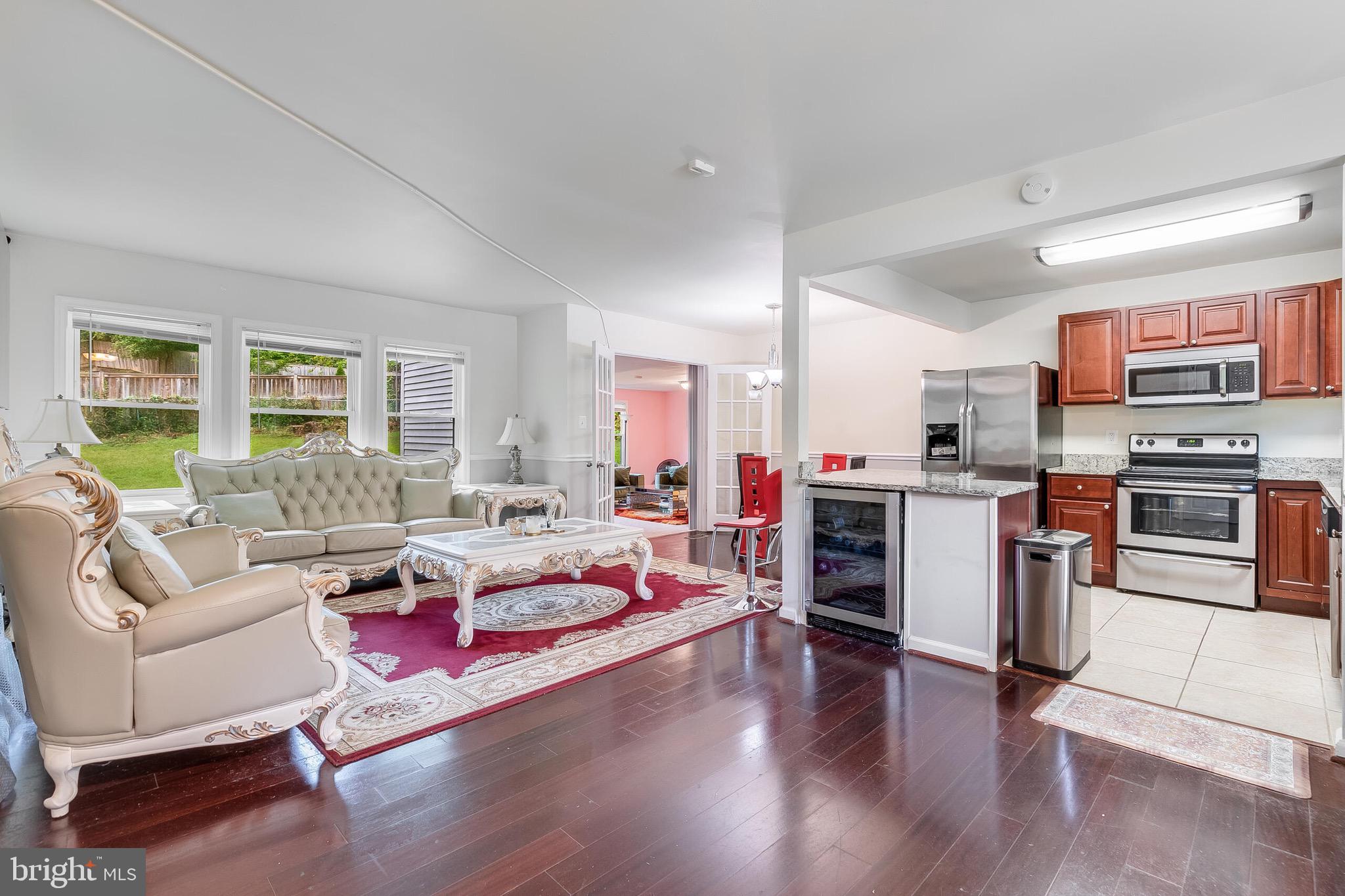 6624 Telegraph Road Alexandria, VA 22310 - Photo 3 of 36 a living room with furniture and a flat screen tv