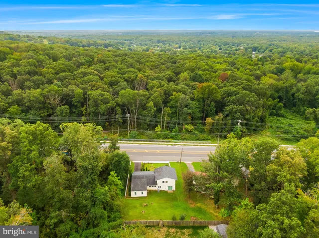 a view of a yard with an ocean view