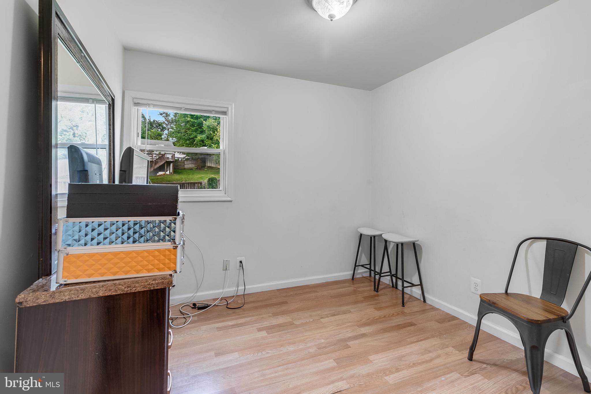 6624 Telegraph Road Alexandria, VA 22310 - Photo 9 of 36 a view of a room with a window and wooden floor