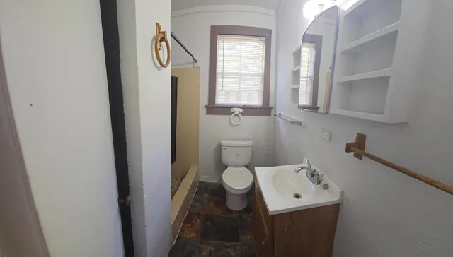 a bathroom with a sink and toilet