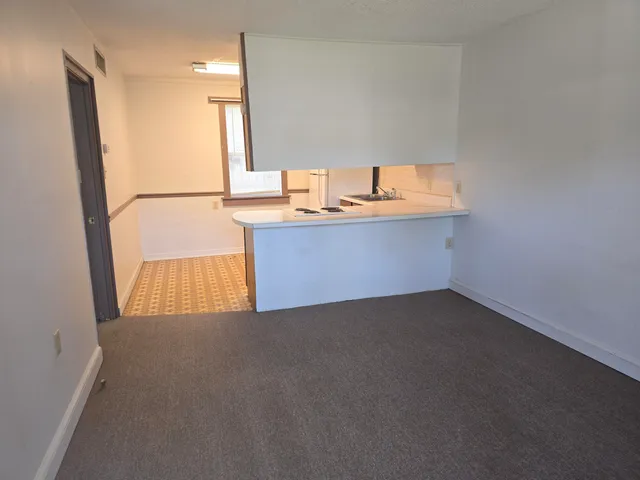 a room with a cabinet and mirror