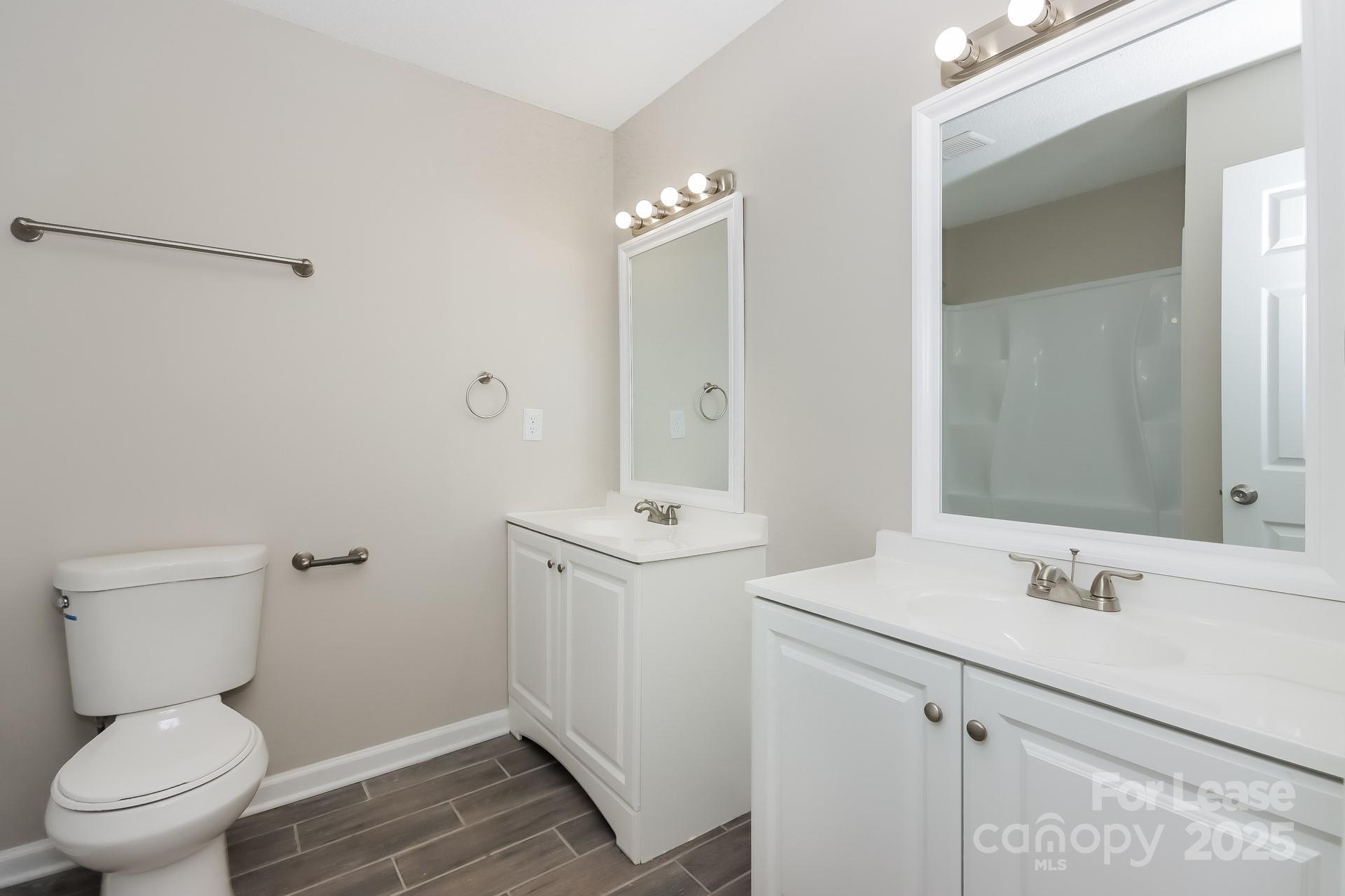 148 Mooreland Road Mooresville, NC 28117 - Photo 8 of 17 a bathroom with a sink toilet and vanity