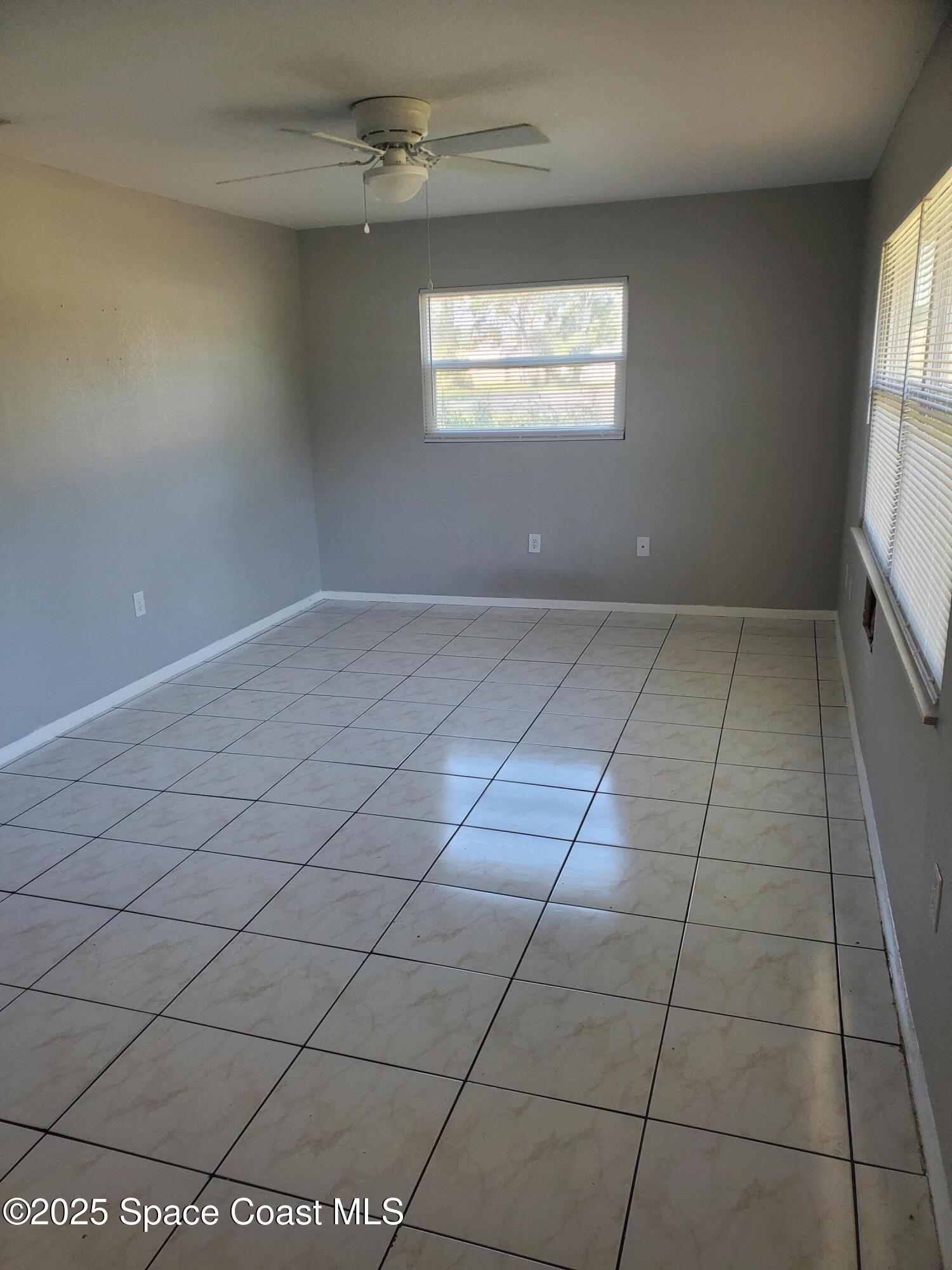 1105 Santa Rosa Drive Rockledge, FL 32955 - Photo 3 of 16 an empty room with a empty space and windows