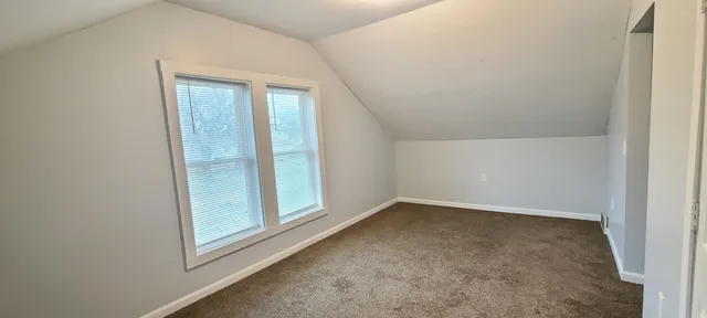 an empty room with a hallway