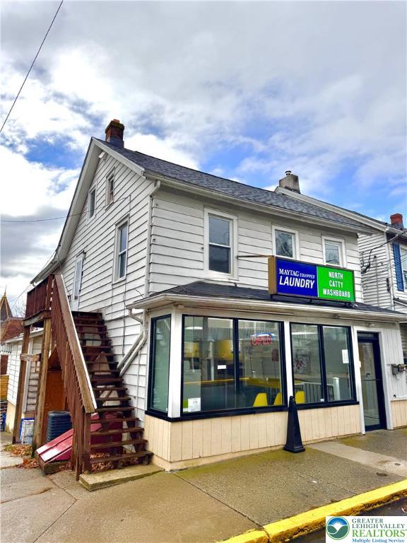 1102 2nd Street, Unit 1 Catasauqua, PA 18032 - Photo 1 of 13 a view of a white building with a outdoor space