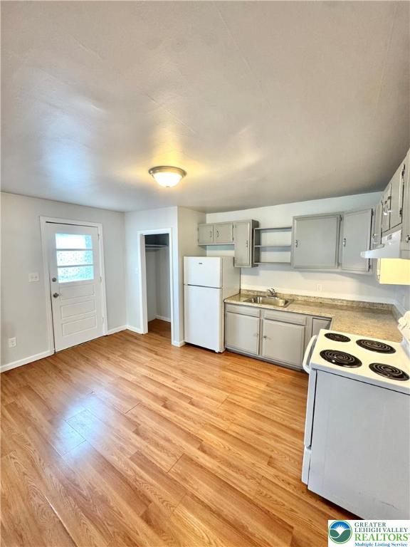 1102 2nd Street, Unit 1 Catasauqua, PA 18032 - Photo 4 of 13 a kitchen with a stove top oven sink and cabinets