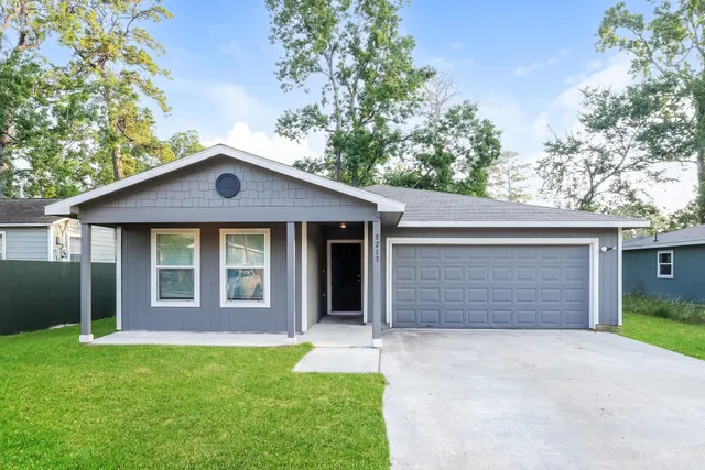 front view of a house with a yard