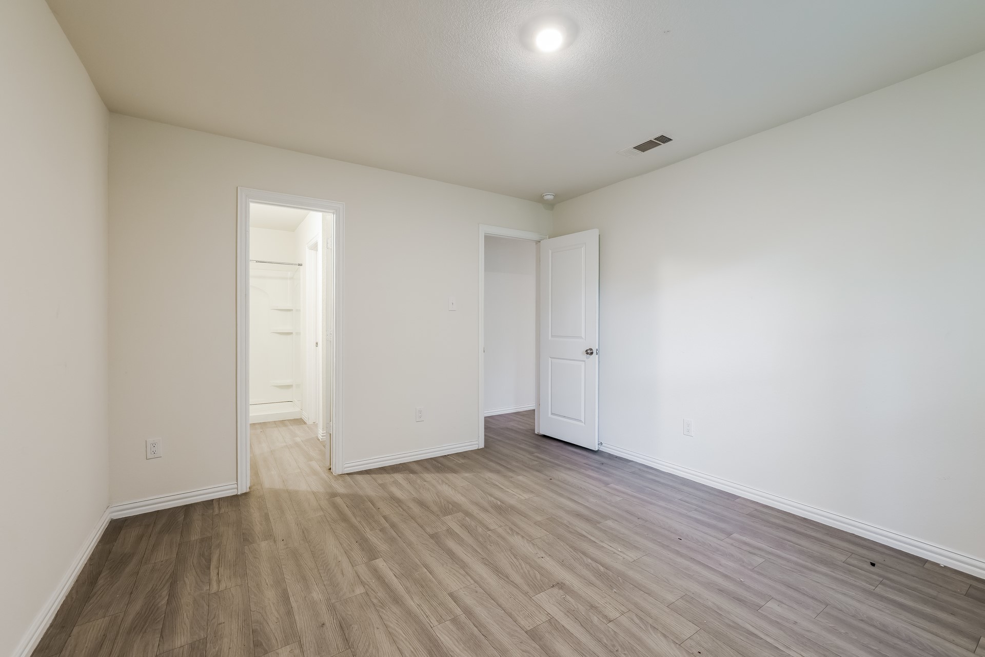 8213 Linda Vista Road Houston, TX 77028 - Photo 9 of 21 a view of an empty room and wooden floor