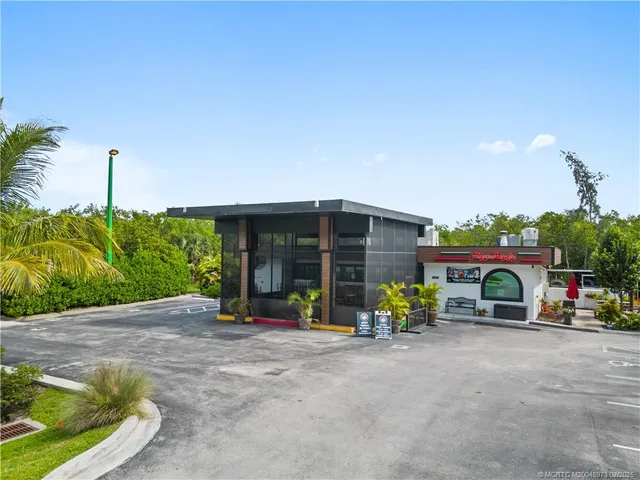 a view of a car park in front of a building